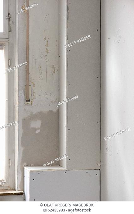 Sewer pipes covered with plasterboard panels, renovation of an old building, Stuttgart, Baden-Wuerttemberg, Germany, Europe
