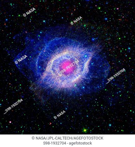 Helix Nebula - Unraveling at the Seams. A dying star is throwing a cosmic tantrum in this combined image from NASA's Spitzer Space Telescope and the Galaxy...