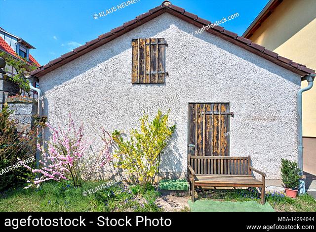 House facade, house bank, spring, village view, Nassach, Hassberge, Lower Franconia, Bavaria, Germany
