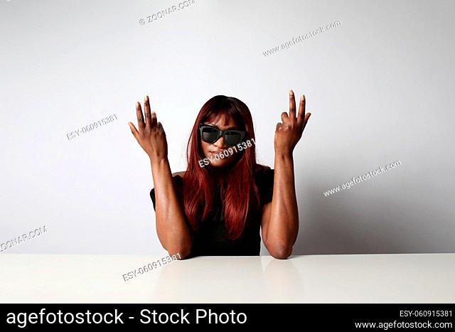 Fashion black woman posing over white background with sunglasses. Isolated. High quality photo