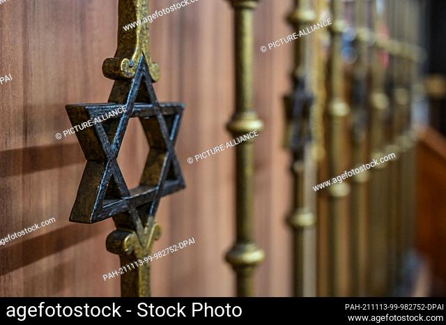 22 October 2021, Saxony-Anhalt, Halle (Saale): A Star of David in the railing to the sanctuary of the Halle Synagogue. Photo: Heiko Rebsch/dpa / Zentralbild/dpa