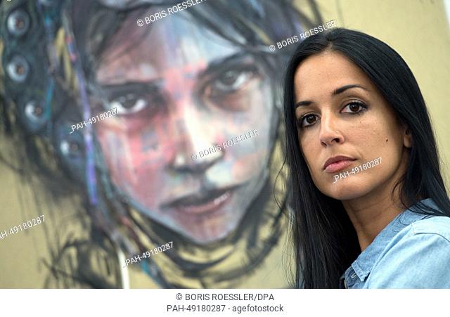 Jasmin Siddiqui from the street art project ""Herakut"" stand in the exhibition ""Colours of Resilience"" in Frankfurt Main,  Germany, 06 June 2014