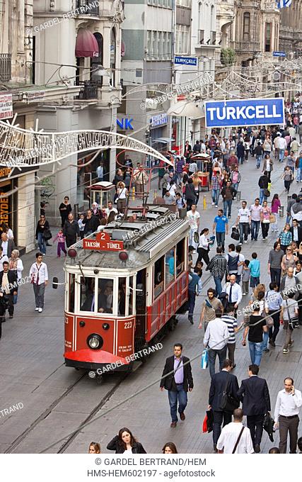 Turkey, Istanbul, Beyoglu, Taksim district, Istiklal Caddesi shopping street is crossed by an ancient tram back