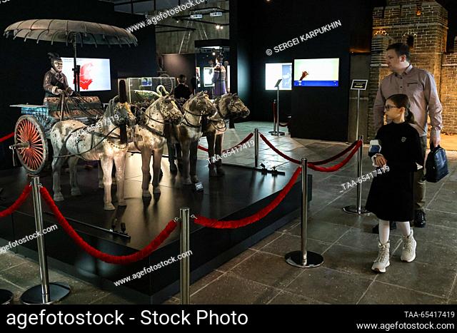 RUSSIA, MOSCOW - DECEMBER 2, 2023: People are seen by Chariot at an exhibition titled ""The Terracotta Army: The Immortal Warriors of China"" at Pavilion 22 at...