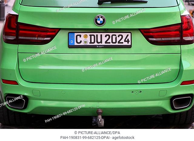 30 August 2019, Saxony, Leipzig: A BMW X5 of the election campaign team of the Prime Minister of Saxony (CDU) with the registration number C-DU 2024 parks at...