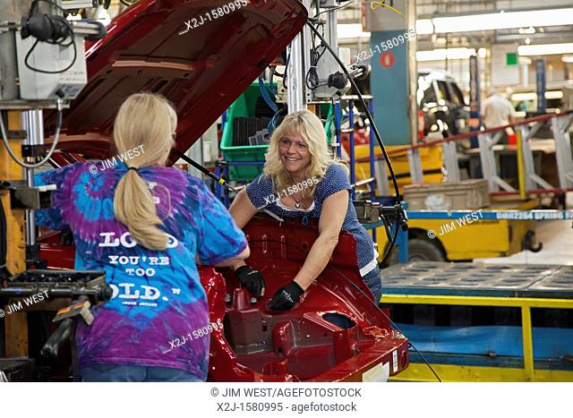 Toledo, Ohio - Kim Olczewski right and Brenda Gibbons work on the assembly line for the Jeep Liberty and Dodge Nitro at Chrysler's Toledo Assembly Complex