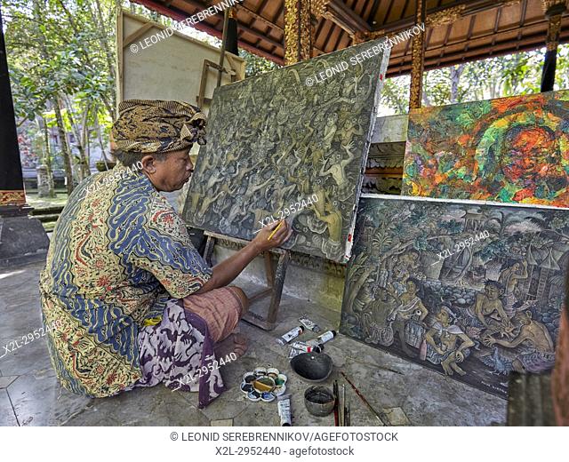 Artist working at the Agung Rai Museum of Art (ARMA). Ubud, Bali, Indonesia