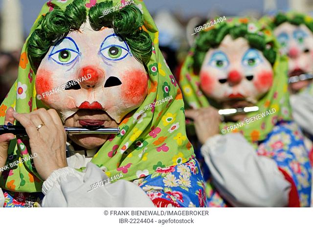 Masked people walking through the streets of Basel at Basler Fasnet carnival, Basel, Switzerland, Europe