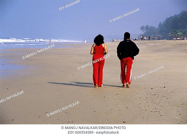 Man and woman jogging at beach , Ganpatiphule , Maharashtra , India MR672