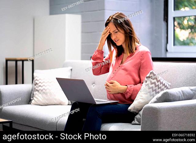 Pregnant Women Doctor Video Call On Laptop At Home