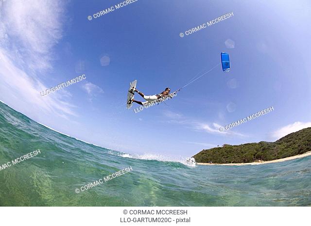 Kite surfer jumping