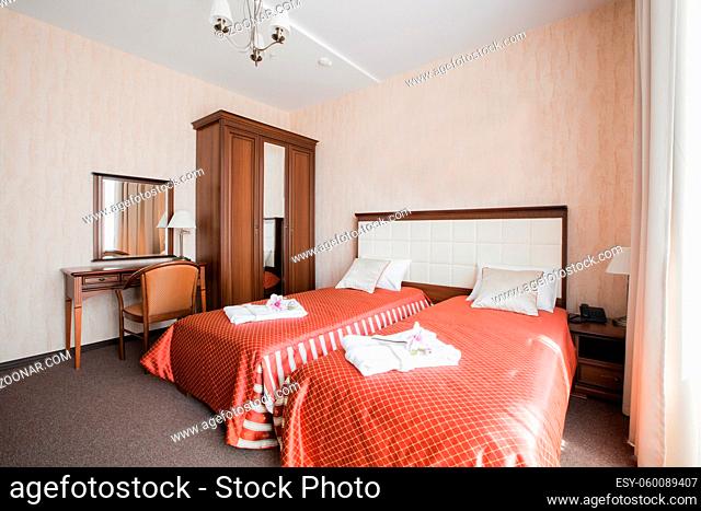 Hotel apartment, bedroom interior in the morning. standart room, with two bed