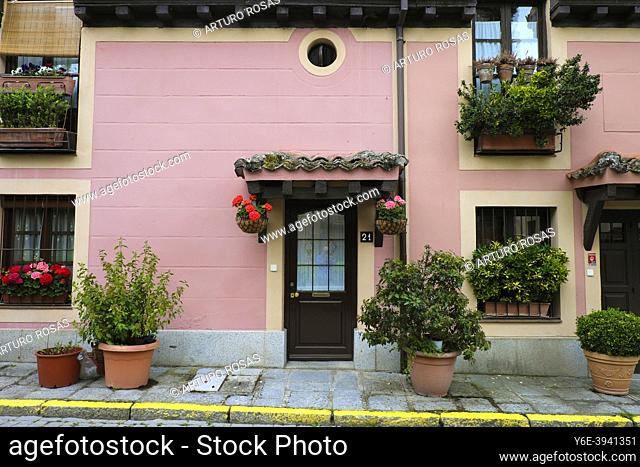 Facade of a house with plants and flowers in Real Sitio de San Ildefonso, Segovia