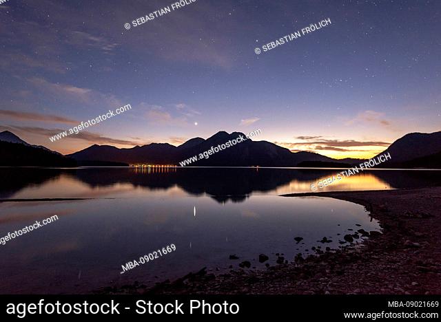 Night and evening mood on the bank of the lake Walchensee in the Bavarian Prealps, in the background the Herzogstand and Heimgarten