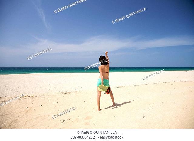 barefoot woman dance at beach