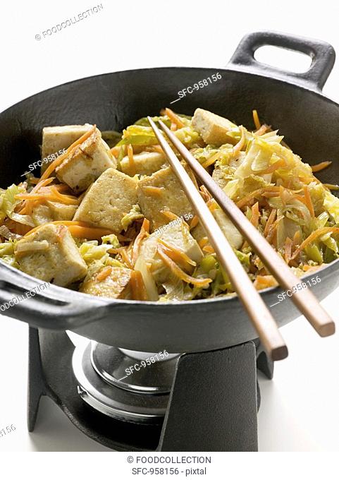 Tofu with vegetables in wok