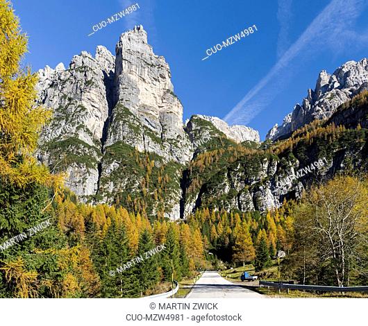 Tamer mountain range in the Dolomites of the Veneto, road leading up to Passo Duran. The Dolomites of the Veneto are part of the UNESCO world heritage
