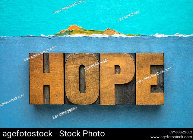 hope word - word abstract in vintage letterpress wood type against abstract paper landscape of a tropical island, positivity, faith and optimism concept