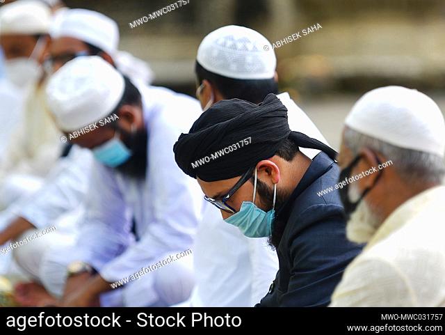 Muslim devotees at a Mosque during prayers. Maintaining social distancing and wearing mask, on the occasion of Eid al Adha
