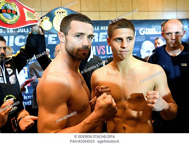 Boxers Giovanni de Carolis (L, Italy) and Tyron Zeuge (Germany) pose at the official weigh-in head of the WBA World Championship in super middleweight in Berlin