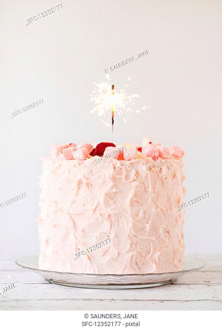 Turkish Delight layer cake with a sparkler candle