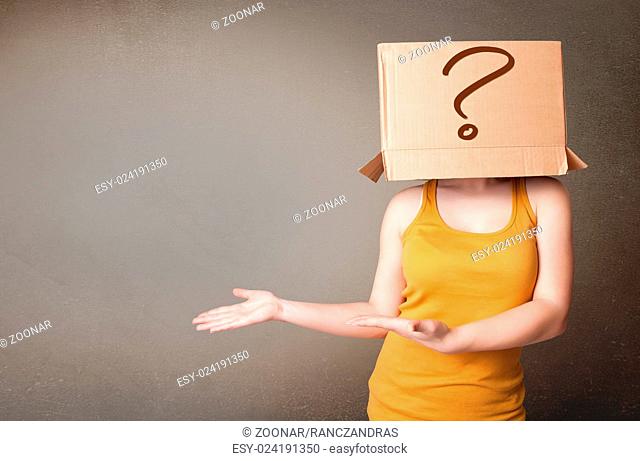 Young lady gesturing with a cardboard box on her head with question mark