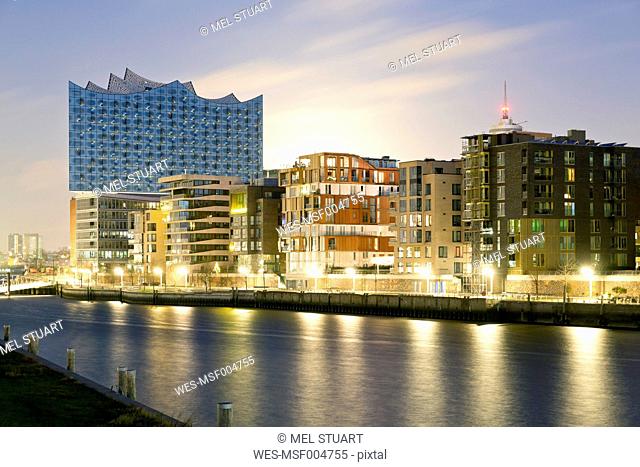 Germany, Hamburg, Hafencity, Grasbrook Harbour with Elbe Philharmonic Hall in the evening