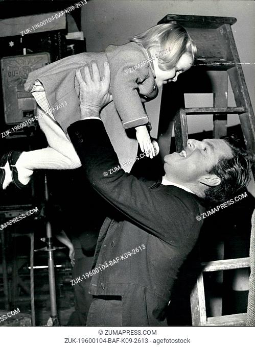 1955 - Kenneth More - Happy Father: No. 1 of the year, Kenneth More, says Hello to his little daughter when she visits him at Shepperton Studios where he is...