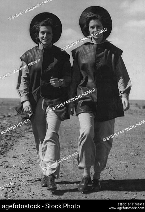Miles From Home -- Operators of Kine theodolites, Pat Davies, 21, and Elisabeth Patten, 18, of Adelaide, arrive for duty at Woomera ballistic range