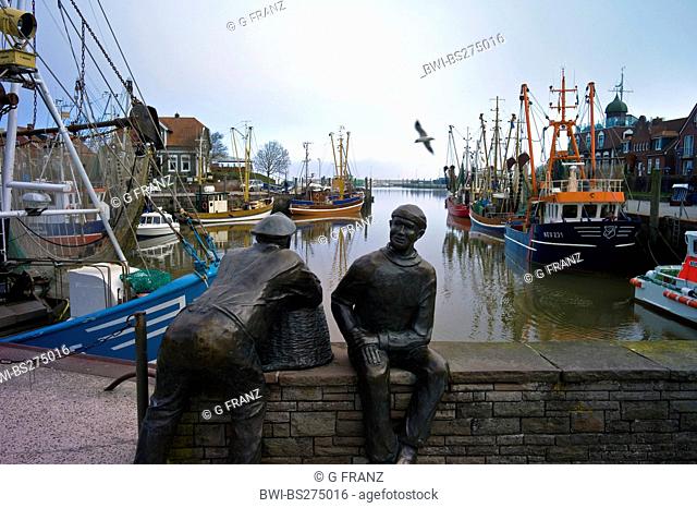 sculpures 'fishermen' in harbour, Germany, Lower Saxony, Neuharlingersiel