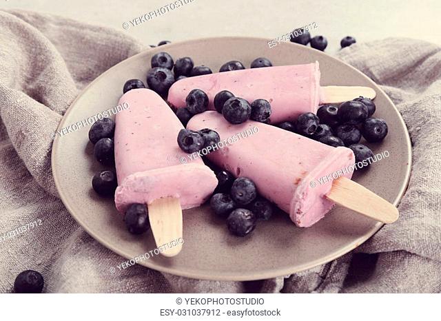 Delicious yogurt popsicle on the table