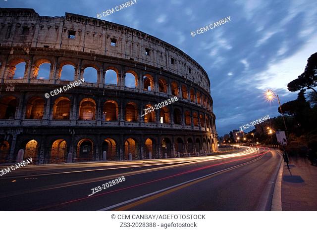 The Roman Colosseum and car light-trails, Rome, Lazio, Italy