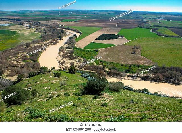 Landscape seen from Almodovar Castle. Fields of farming beside the shore of Guadalquivir River