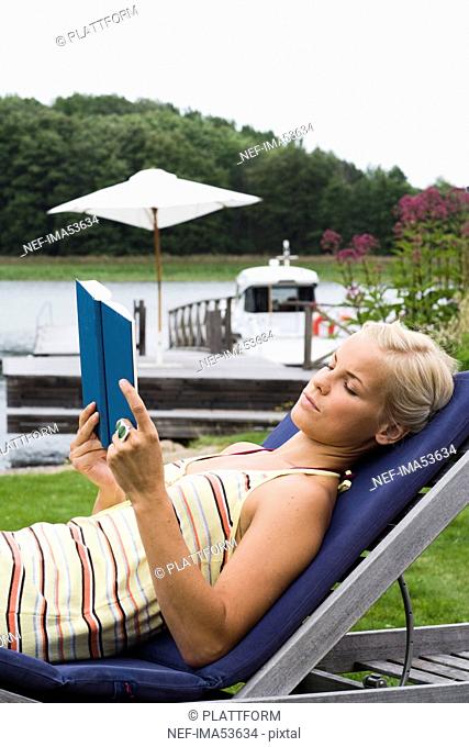 A woman reading a book, Sweden