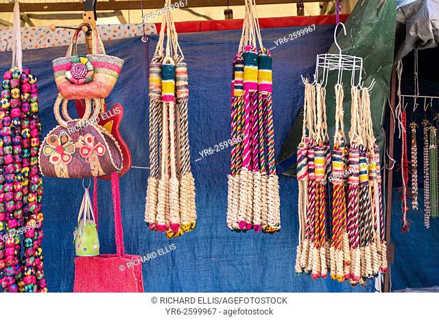 Religious icons and whips for sale at small stalls for Mexican pilgrims and penitents at the Sanctuary of Atotonilco an important Catholic shrine in Atotonilco