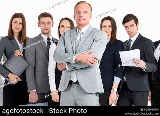 Group of business people holding documents. Business team isolated over white background