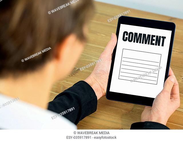 Comment text and graphic on tablet screen with hands