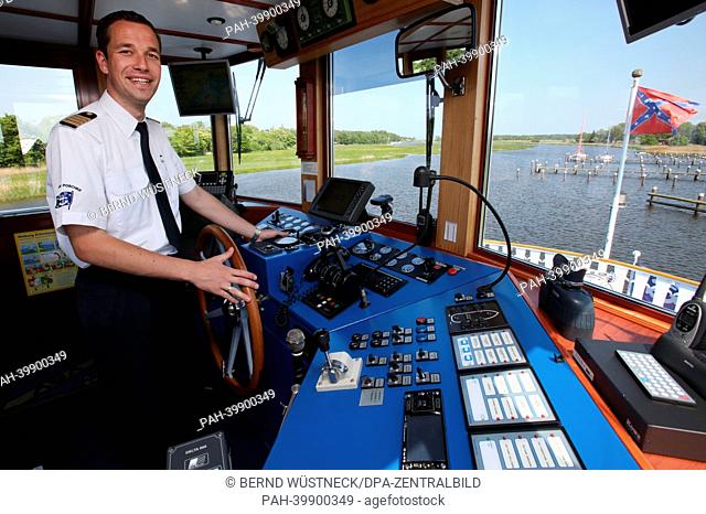 Tassilo Schäfer, captain of the Mississippi steamer 'River Star' of the shipping company Poschke is pictured in the bodden port of Prerow, Germany, 30 May 2013