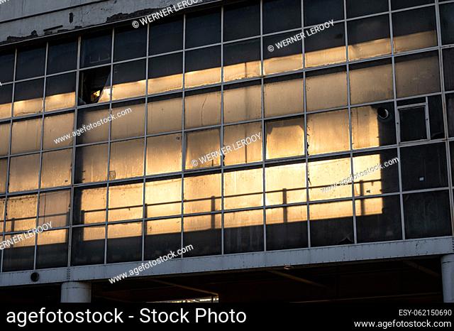 Molenbeek, Brussels Capital Region, Belgium Partly demolished glass window facade of the industrial Kanal warehouse