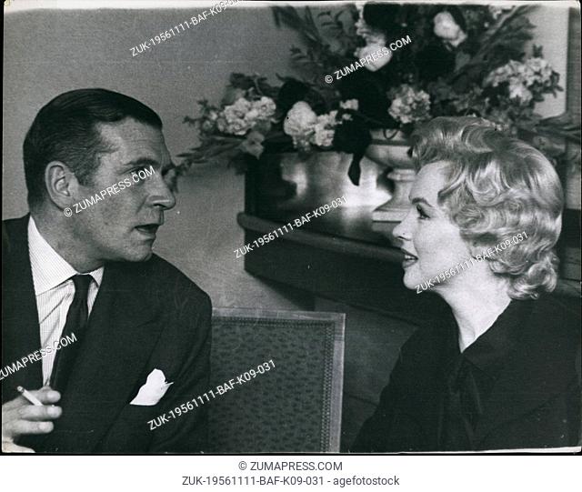 Nov. 11, 1956 - Watched by Marilyn, Sir Laurence Olivier answers questions put by the Press in connection with the film 'The Sleeping Princess' which they are...