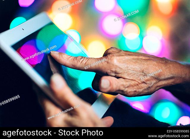 Closeup on elderly woman using a digital tablet