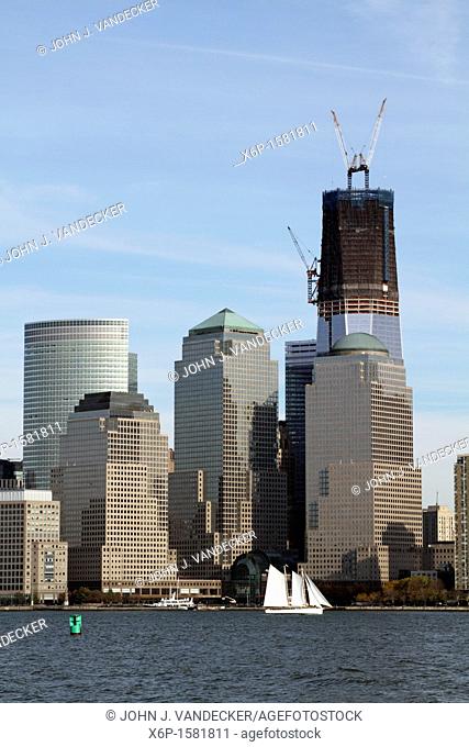 The Freedom Tower under construction and rising from Ground Zero, the scene of the 9/11 terrorist attack  World Financial Center is in the foreground  New York...