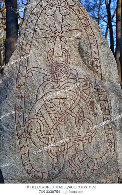 Ancient Viking Runestone U 124, Karlberg Palace Park, Solna, Stockholm, Sweden, Scandinavia. Inscription says "Anund and Torgild set this stone to commemorate...