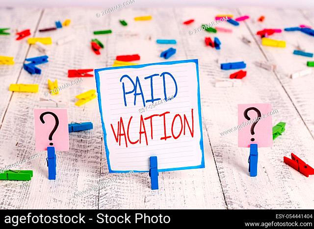 Conceptual hand writing showing Paid Vacation. Concept meaning Sabbatical Weekend Off Holiday Time Off Benefits Crumbling sheet with paper clips placed on the...
