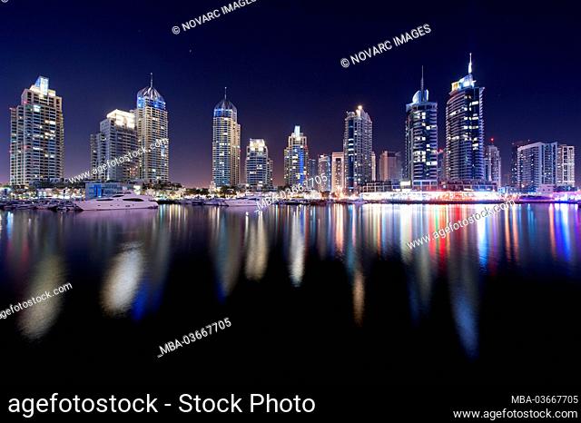 Skyscrapers in Dubai Marina at night with reflections, New Dubai, United Arab Emirates