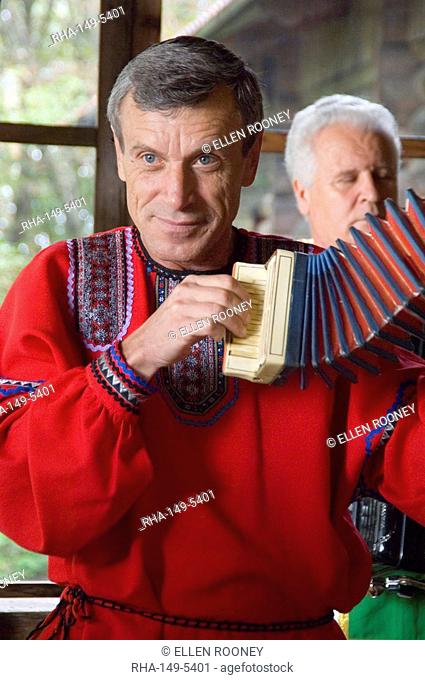 An accordian player in a Russian folk costume at the Dagomys Tea Plantation near Sochi, Russia, Europe
