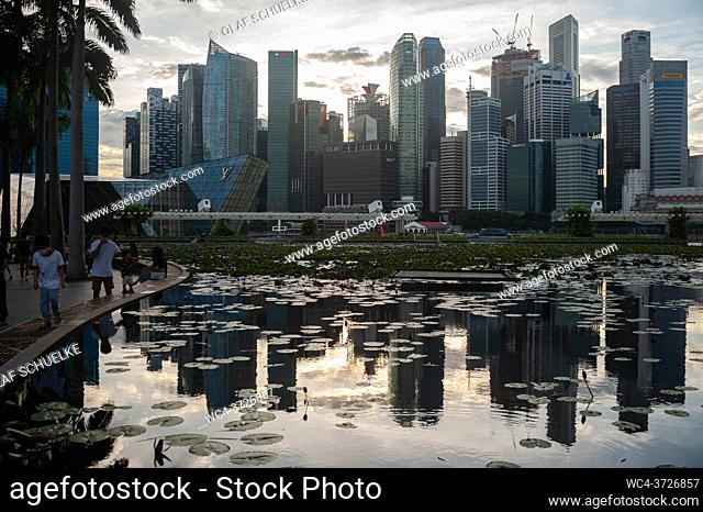 Singapore, Republic of Singapore, Asia - The city skyline with its modern skyscrapers of the central business and financial district at Marina Bay is reflected...