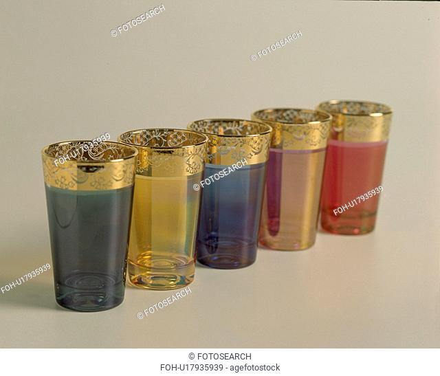 Close-up of colourful glass Moroccan tea-glasses with gold rims
