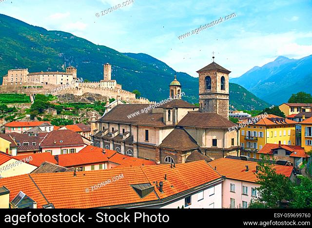 View of beautiful ancient city of Bellinzona in Switzerland with Collegiata dei Ss. Pietro e Stefano church and Castelgrande castle on background