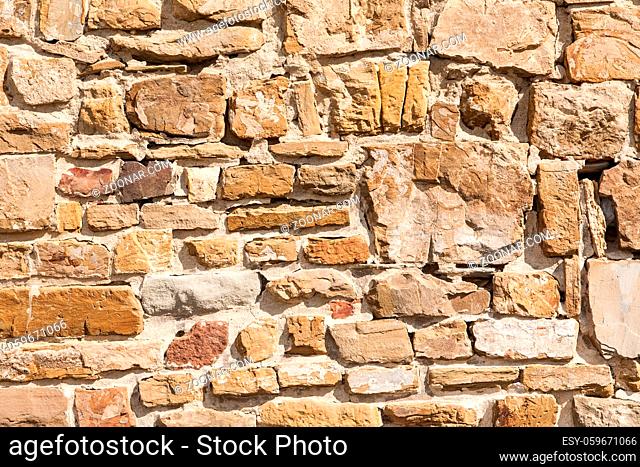 Stone wall texture background natural color. Closeup
